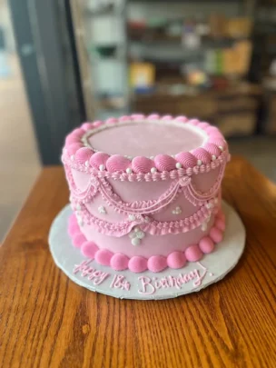 18th Birthday Cake - Pink frosting with writing that reads, 'Happy 18th Birthday!'