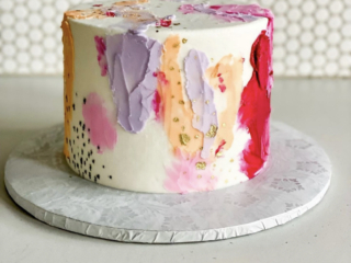 pallete marks with purple, pink, orange gold splatter cake