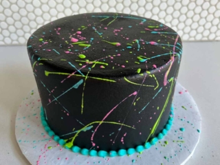 Smooth splatter neon colors black cake