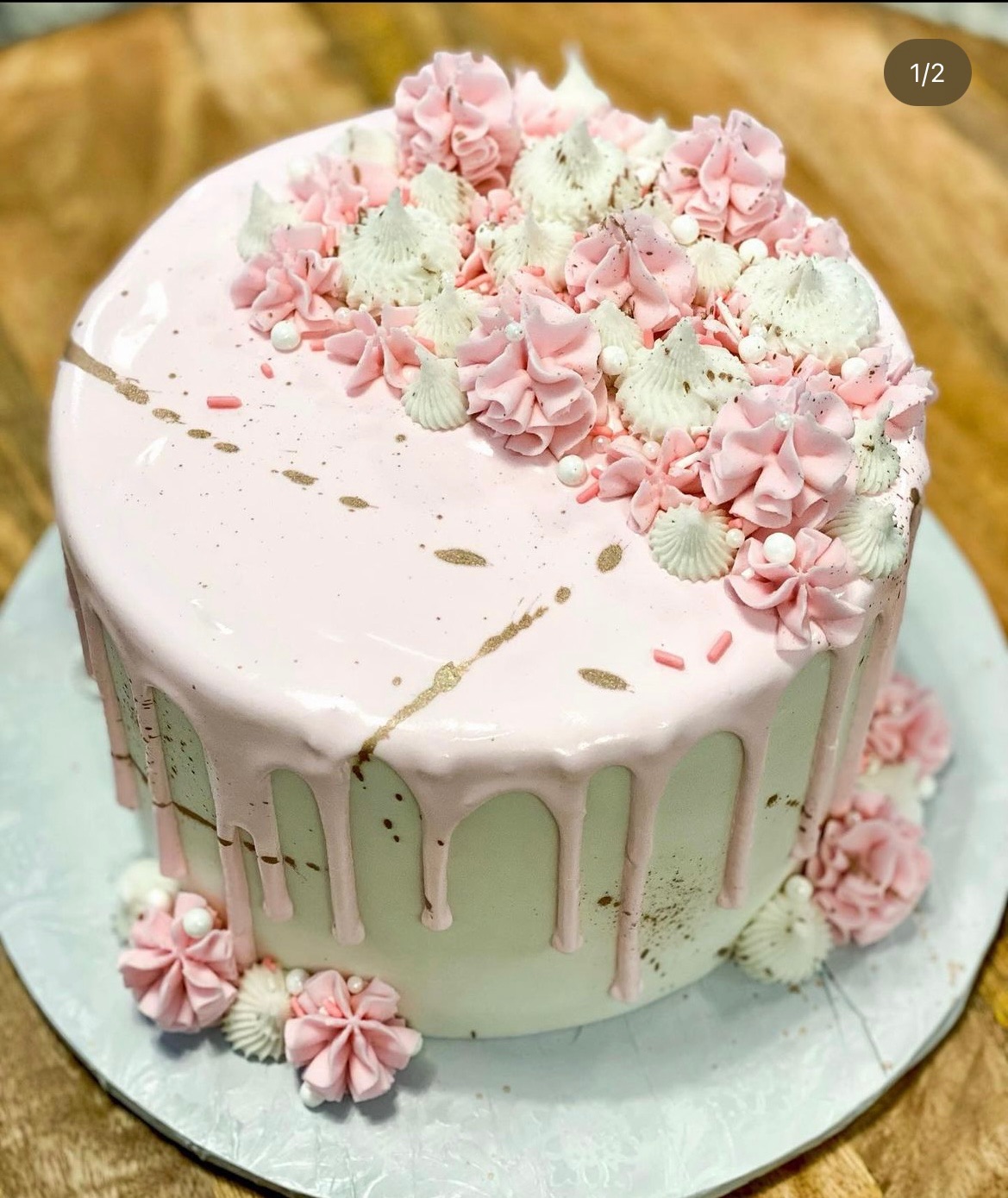 Drip cake with pink white star tips gold splatter