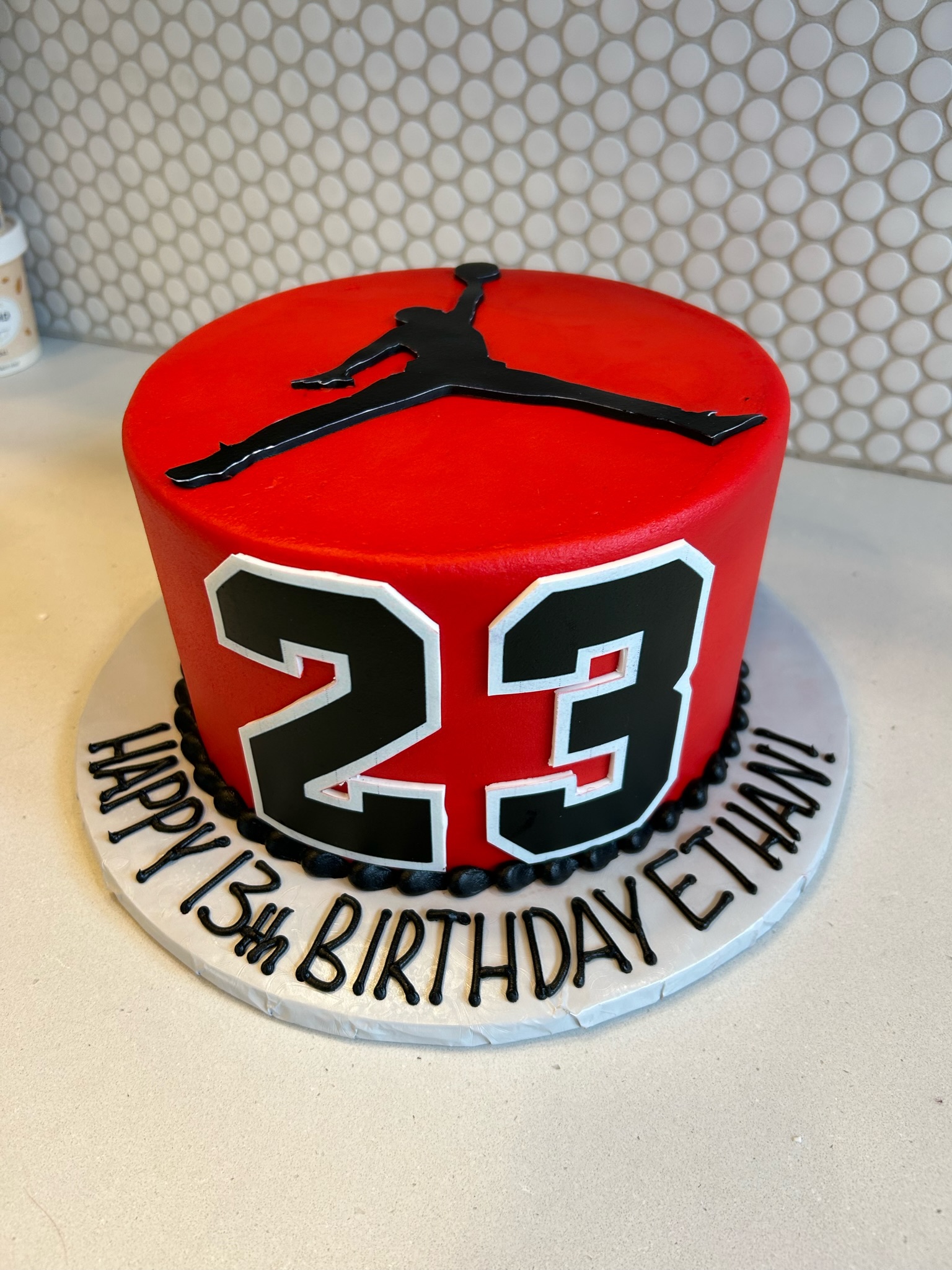 red with 23 number and michael jordan in dunk position