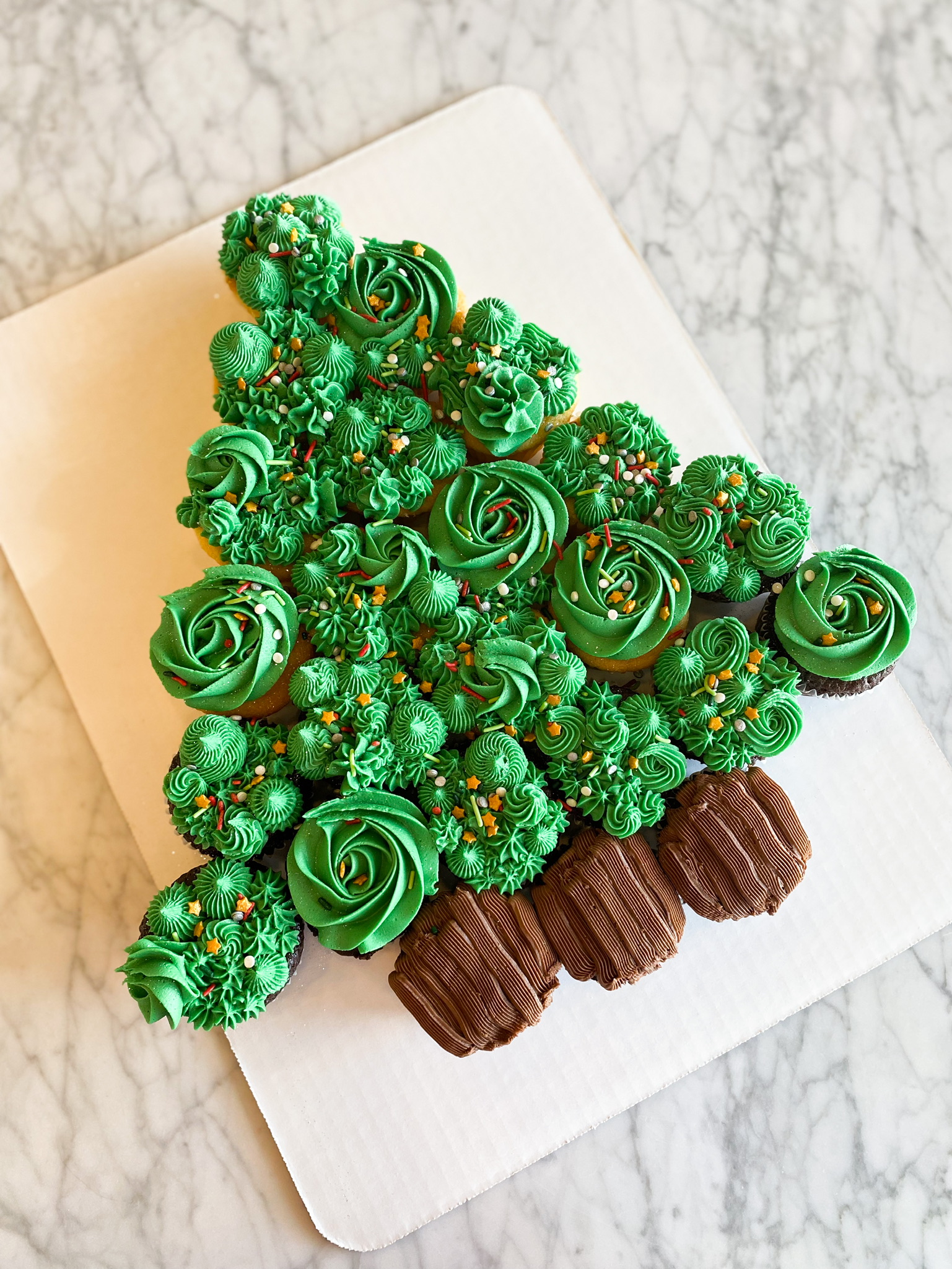 green holiday tree with cupcakes and sprinkles