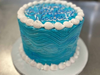 shell piping wavy blue icing cake