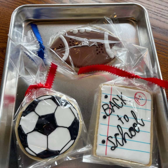 sugar cookies in shape of sports balls football soccer ball