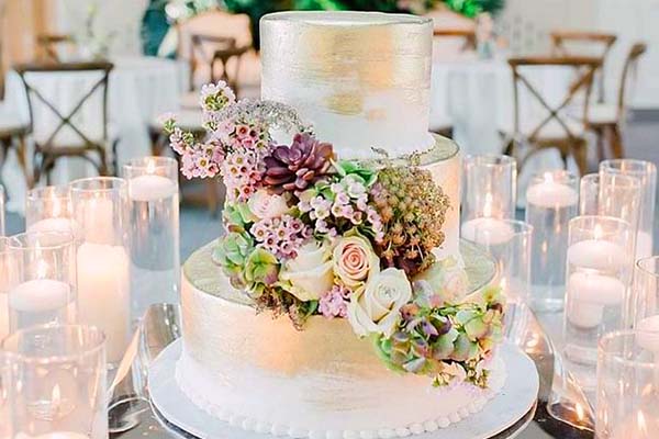 Wedding Cakes with Flowers Flowing Around the Cake by Sweet LaLa's Bakery, Memphis TN.