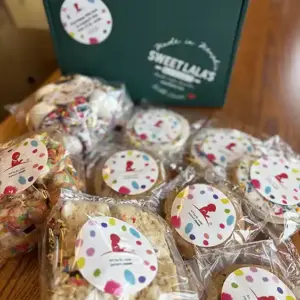 St. Jude Treats and Sweets selection of treats and cookies shown with Sweet LaLa's gift box.